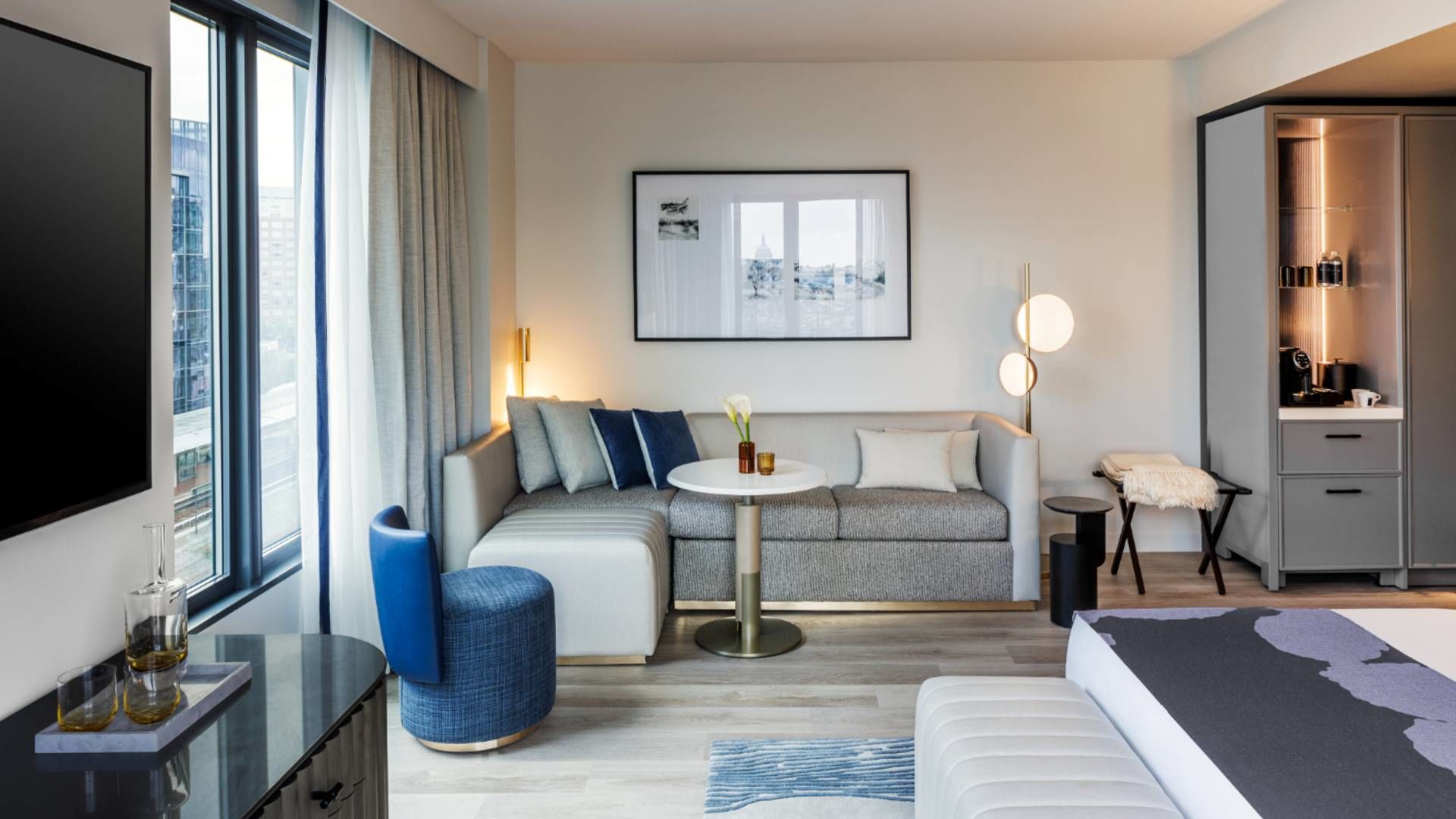 A Living Room With A Tv And Couches